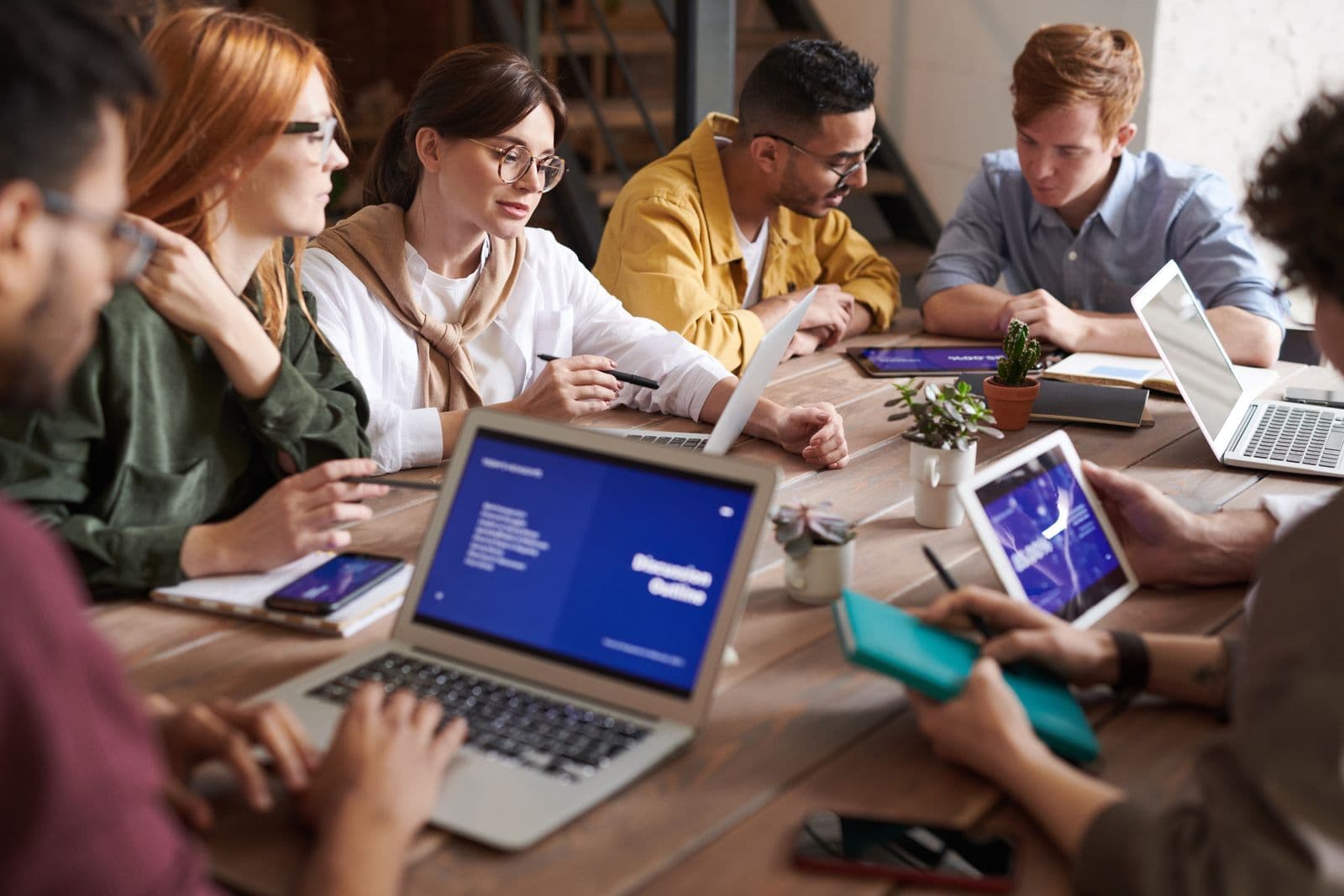 The account team working together around a shared table